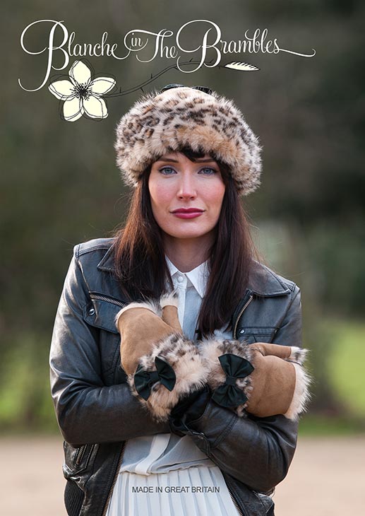 Fashion Cover shot of Young Woman in Fur Hat anfd Glovess